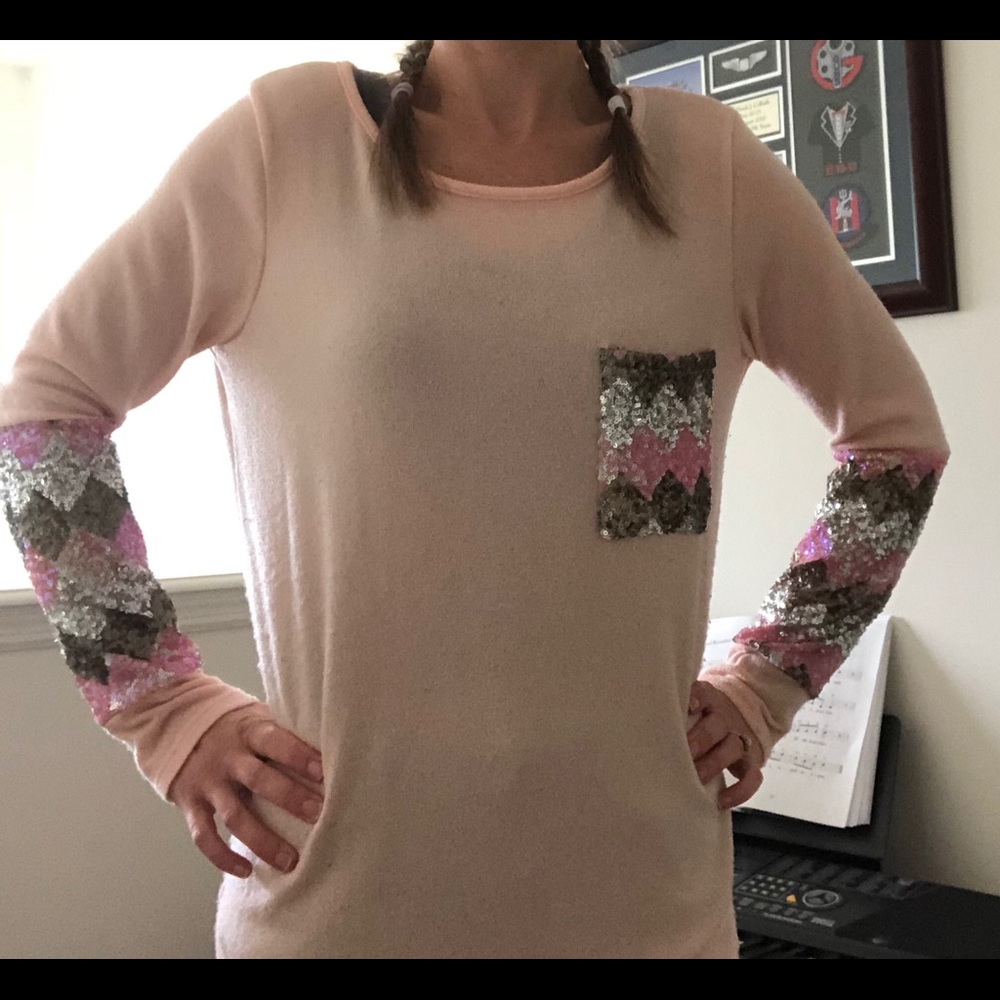 Sweater with glitter accents on sleeve and pocket